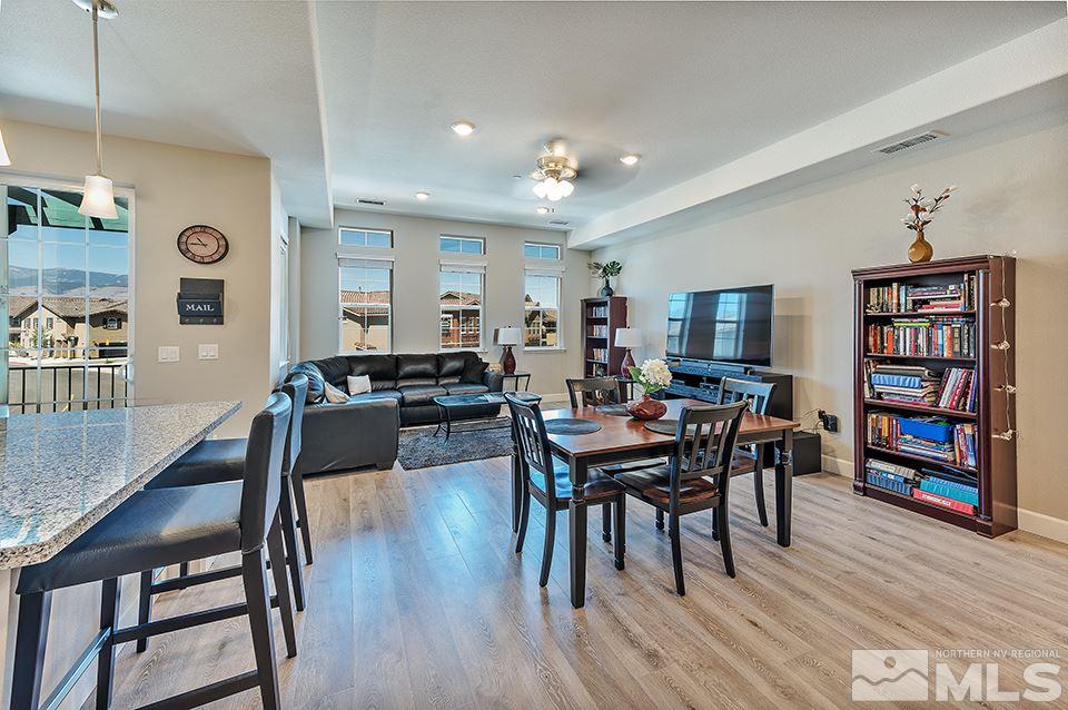 1920 Dark Horse Road, Unit A103 Reno, NV 89521 - Photo 3 of 15 a view of a dining room with furniture and wooden floor