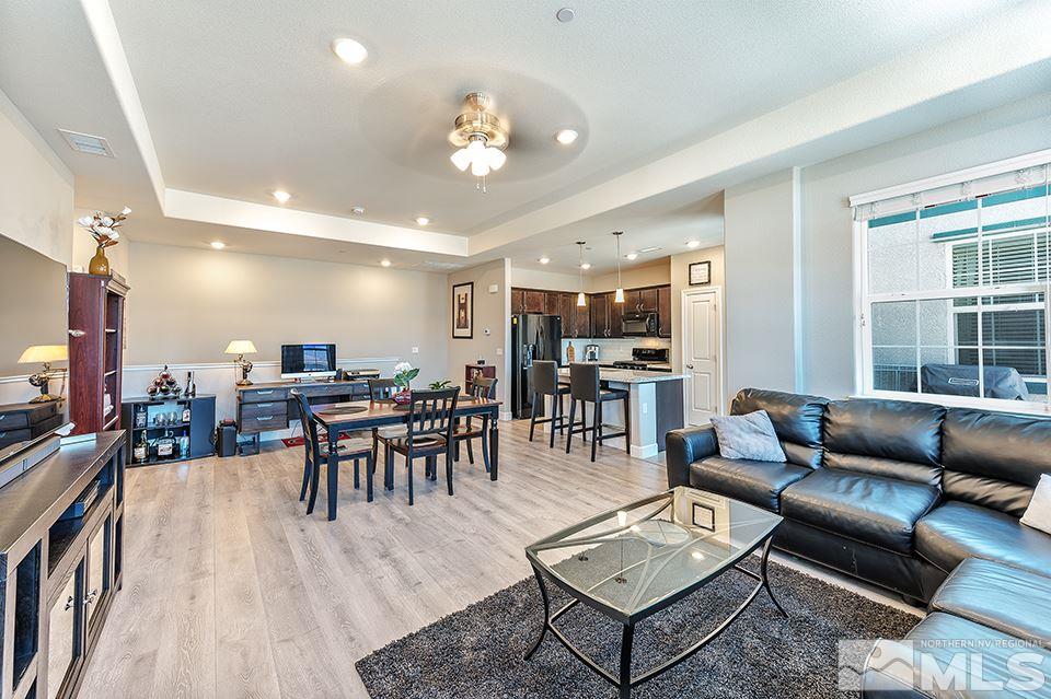 1920 Dark Horse Road, Unit A103 Reno, NV 89521 - Photo 5 of 15 a living room with furniture kitchen view and a large window