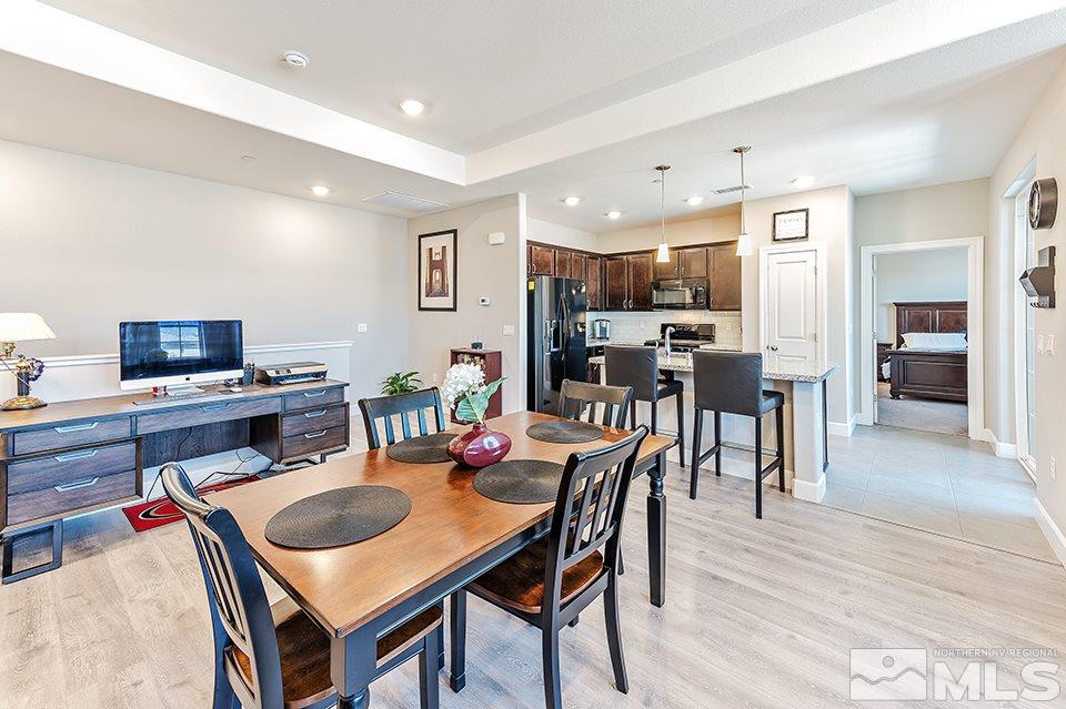 1920 Dark Horse Road, Unit A103 Reno, NV 89521 - Photo 6 of 15 a view of a dining room with furniture