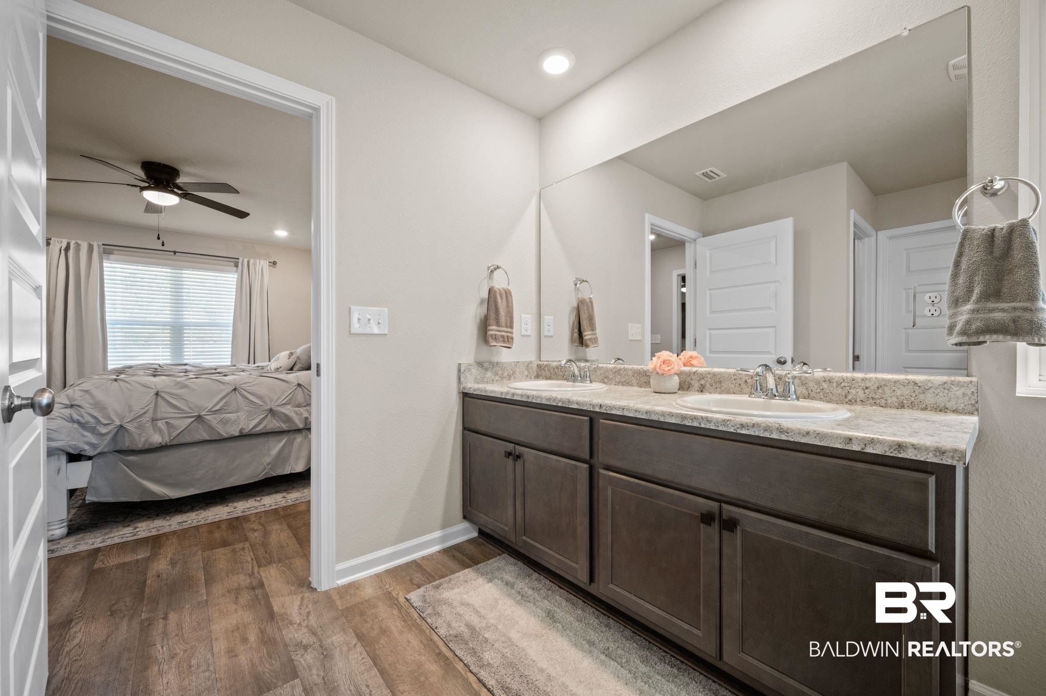 10306 Brodick Loop Spanish Fort, AL 36527 - Photo 17 of 35 Bathroom with hardwood / wood-style floors, vanity, and ceiling fan