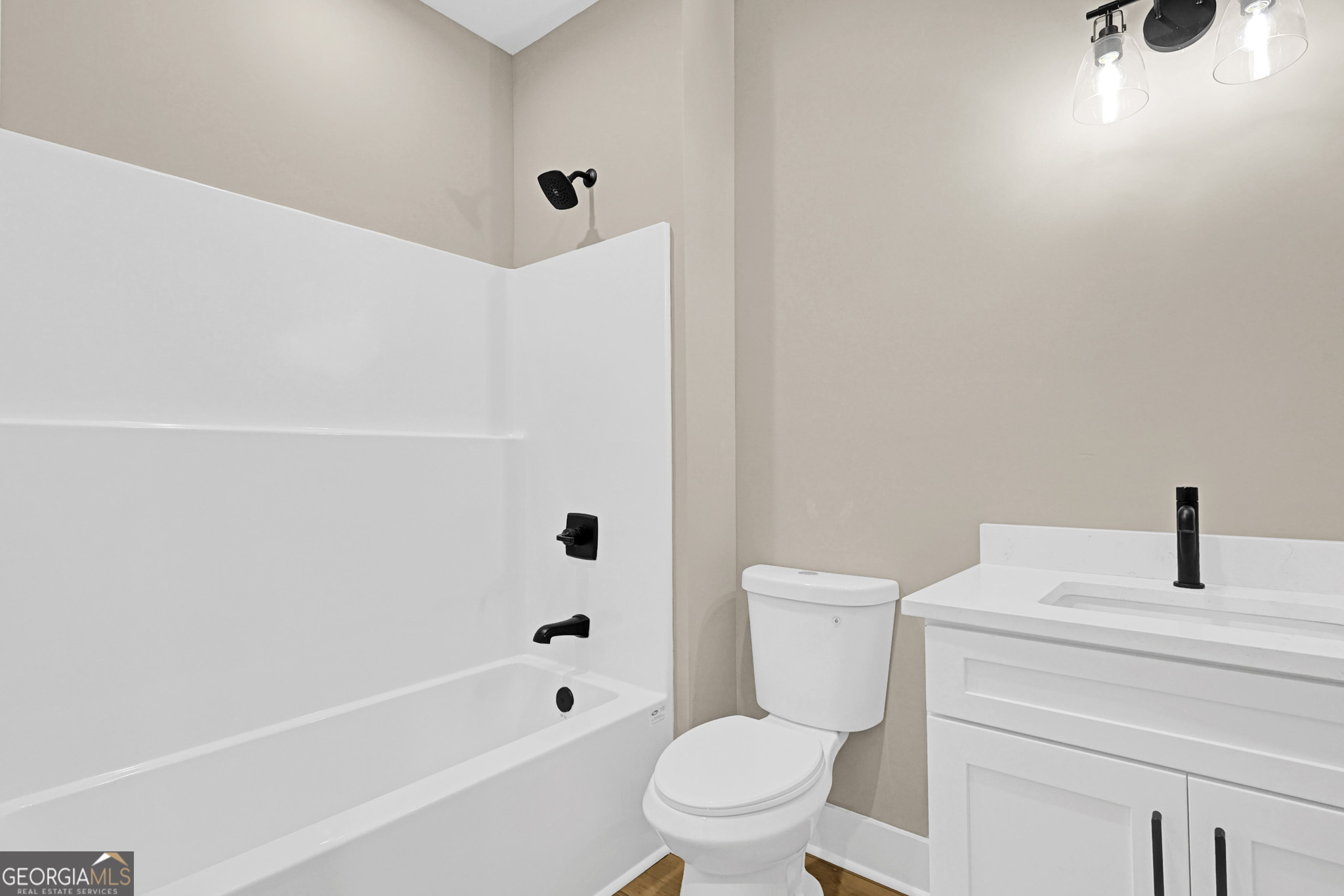 507 North Ridge Road Barnesville, GA 30204 - Photo 12 of 22 a bathroom with a bathtub shower sink vanity and toilet