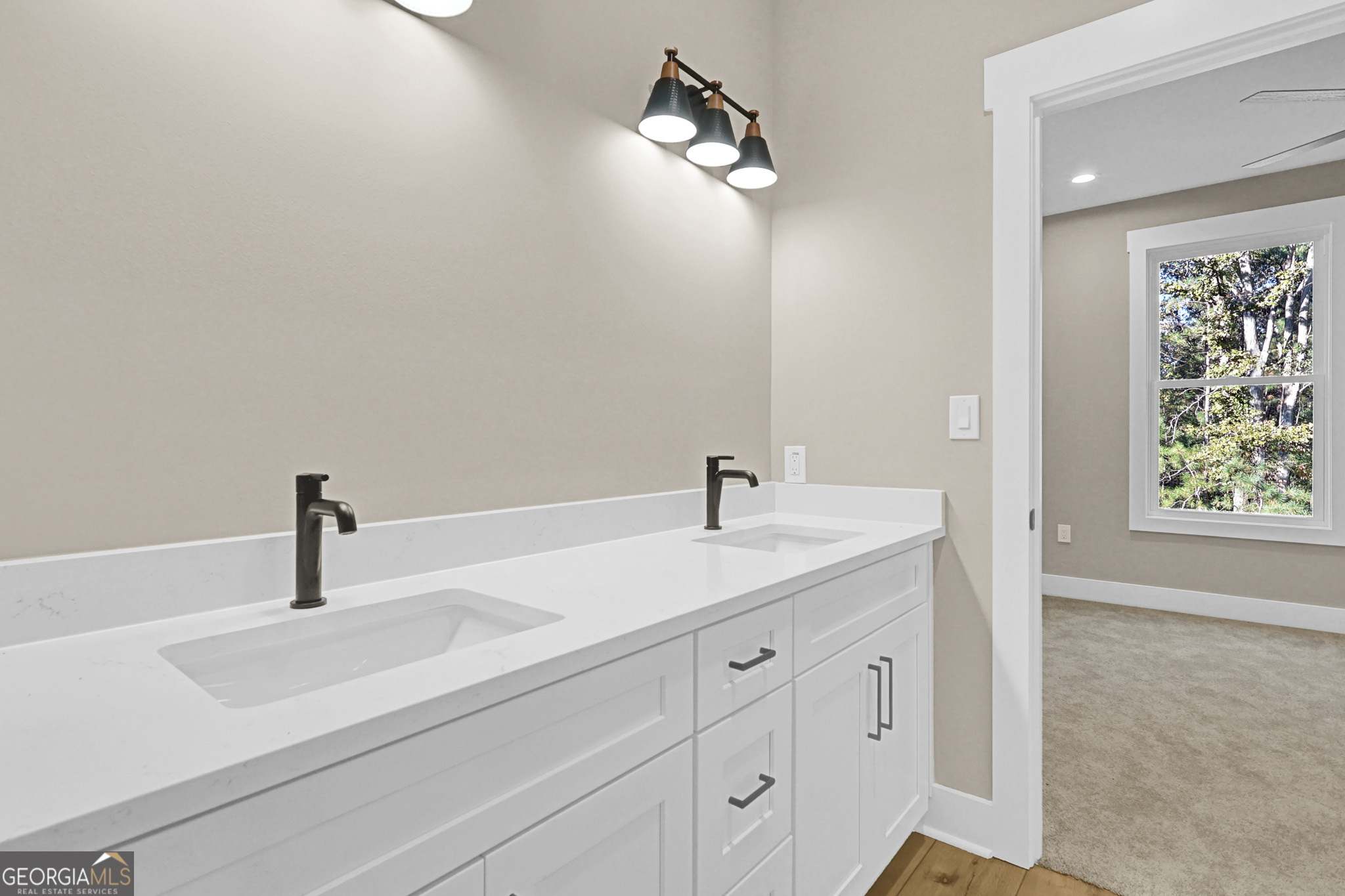 507 North Ridge Road Barnesville, GA 30204 - Photo 19 of 22 a bathroom with a sink and a mirror
