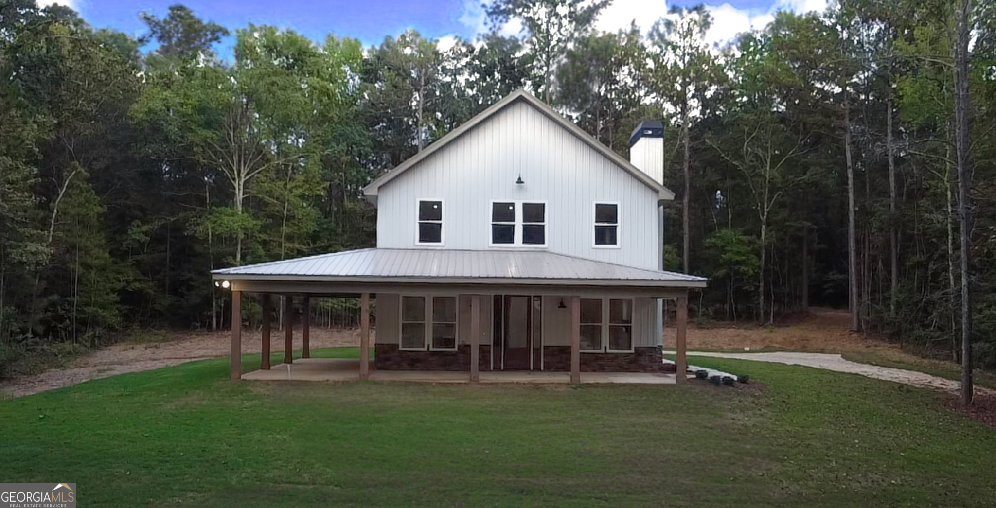 507 North Ridge Road Barnesville, GA 30204 - Photo 2 of 22 a front view of house with yard outdoor seating and green space