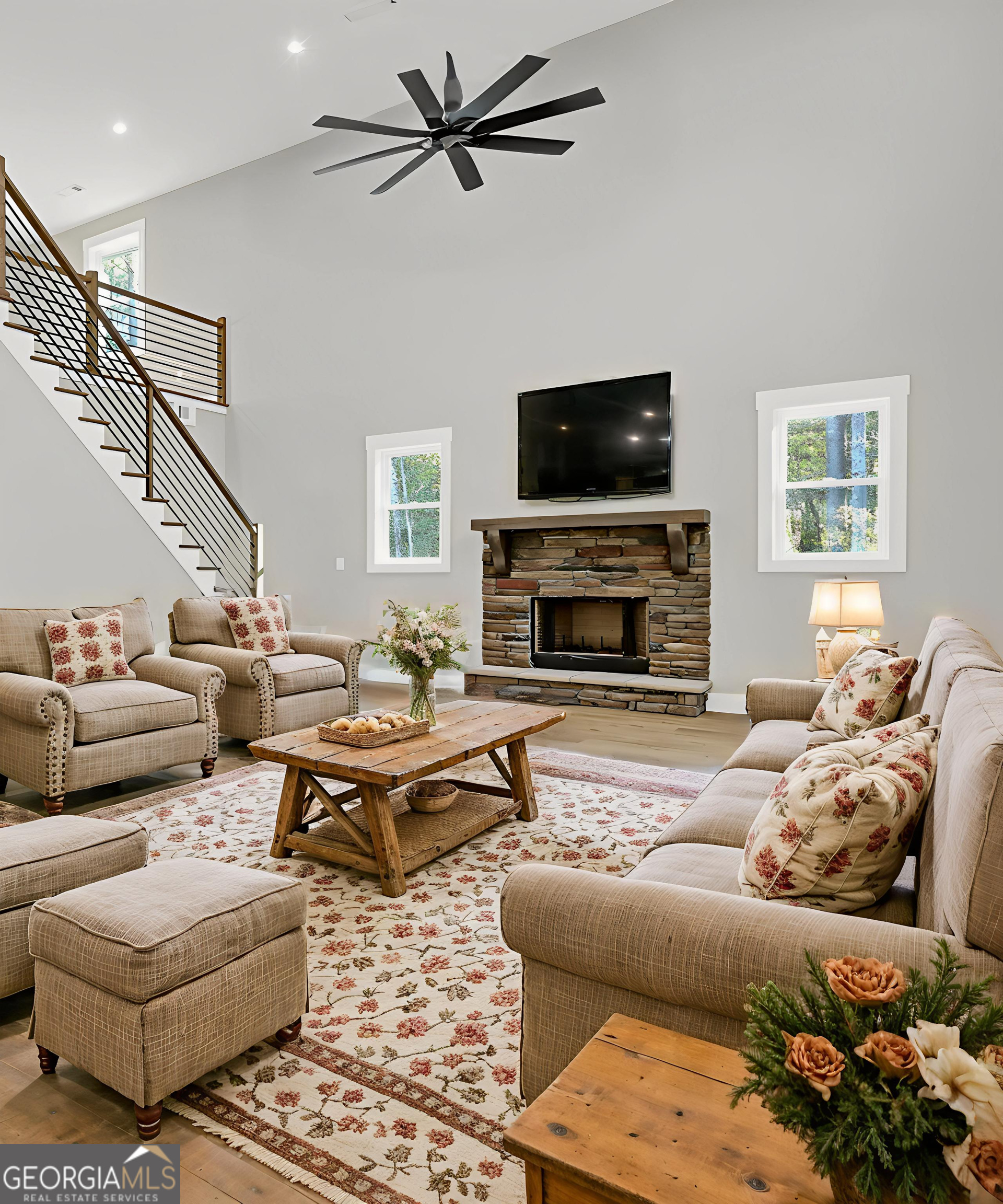 507 North Ridge Road Barnesville, GA 30204 - Photo 4 of 22 a living room with furniture a flat screen tv and a fireplace