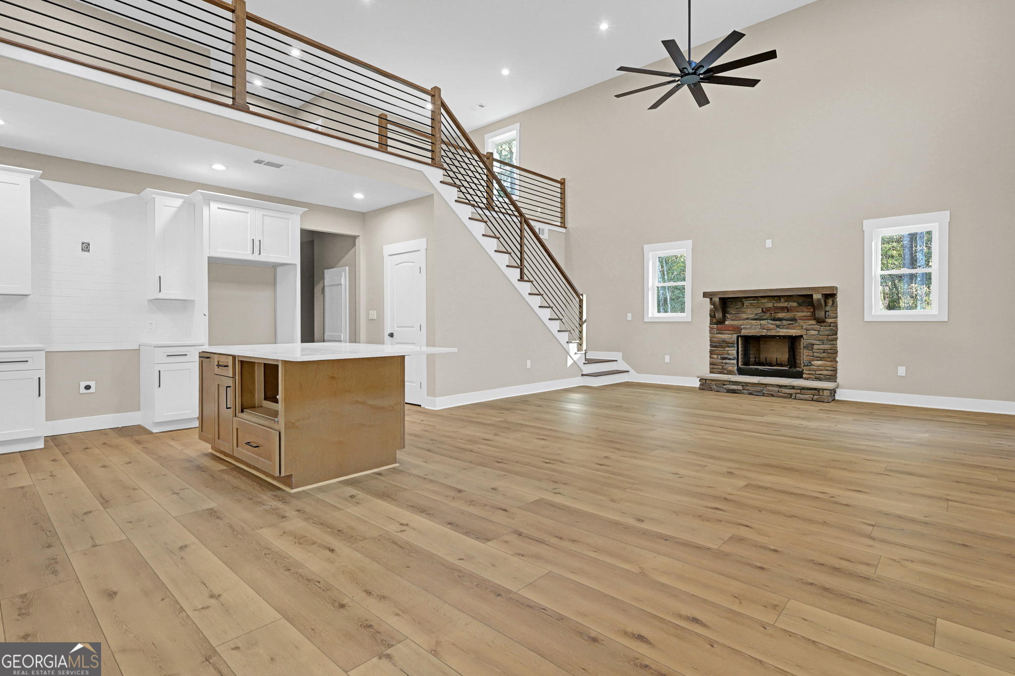 507 North Ridge Road Barnesville, GA 30204 - Photo 5 of 22 a view of a livingroom with wooden floor and a ceiling fan