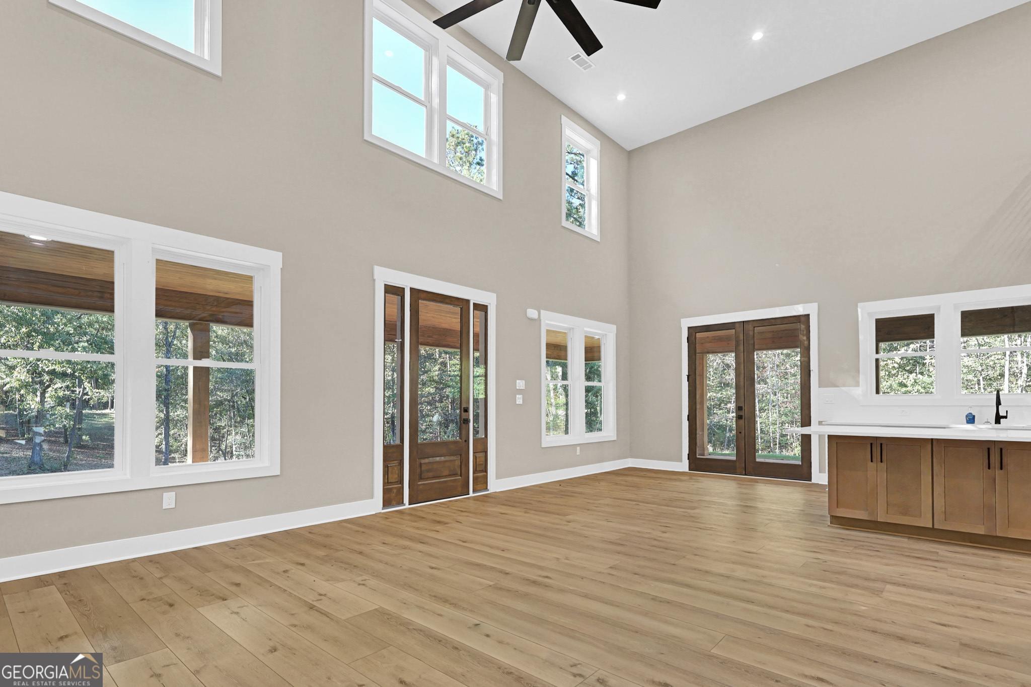507 North Ridge Road Barnesville, GA 30204 - Photo 7 of 22 a view of an empty room with wooden floor and a window
