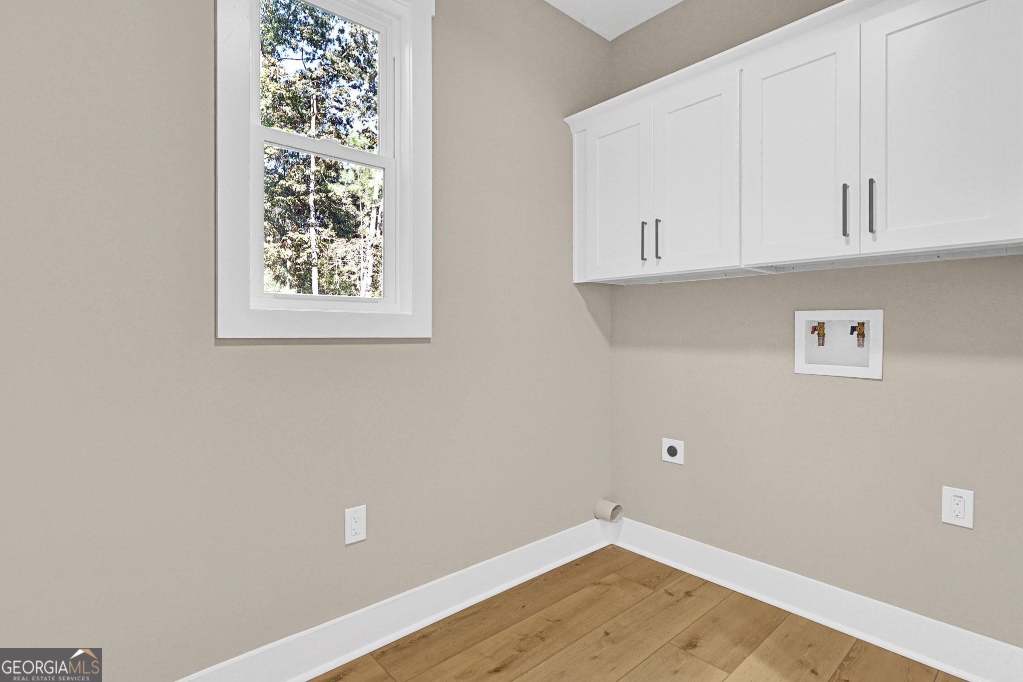 507 North Ridge Road Barnesville, GA 30204 - Photo 10 of 22 an empty room with wooden floor and fan