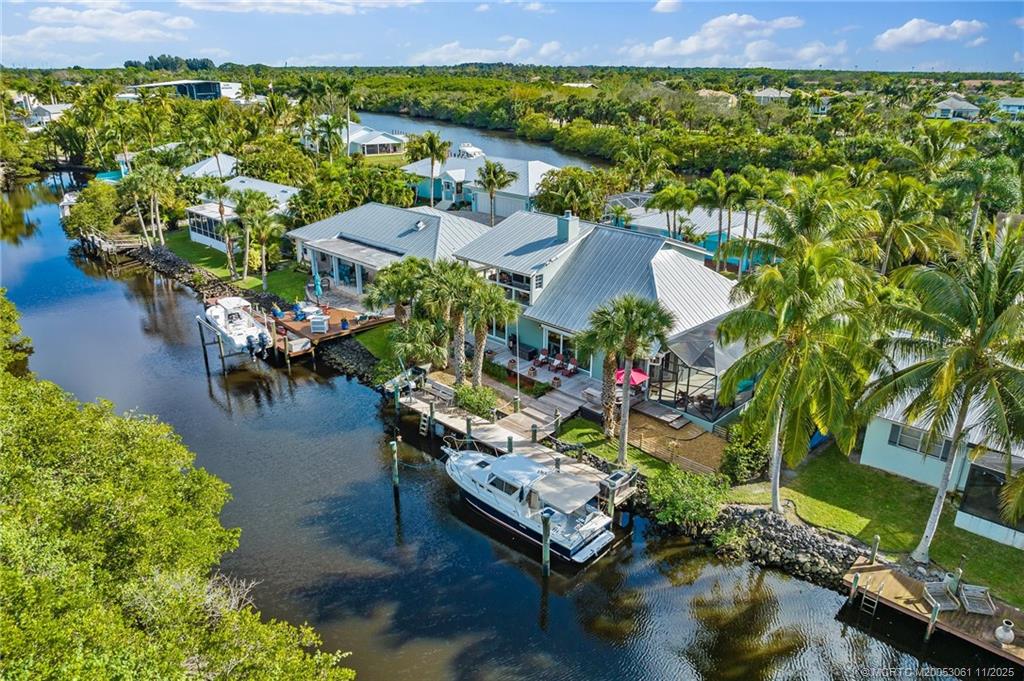 an aerial view of a house with a lake view