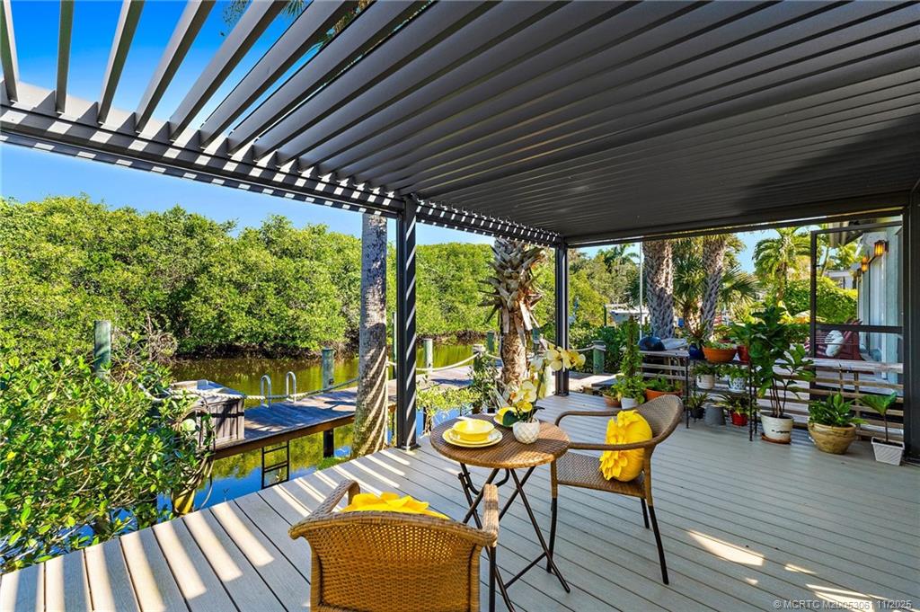 655 Southwest Salerno Road Stuart, FL 34997 - Photo 12 of 84 a view of swimming pool with outdoor seating