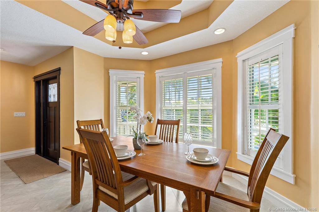 655 Southwest Salerno Road Stuart, FL 34997 - Photo 22 of 84 a view of a dining room with furniture window and outside view