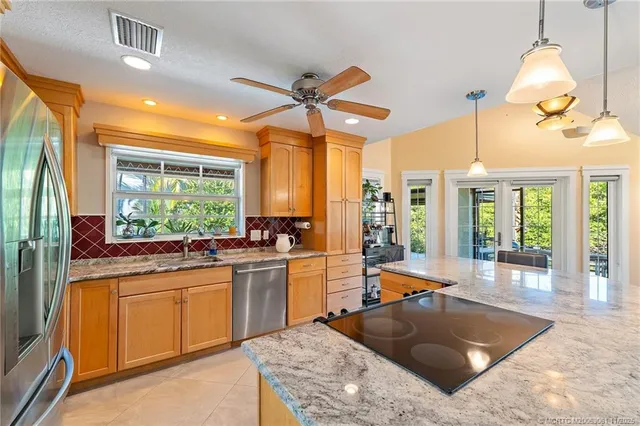 a bathroom with a sink a mirror a vanity and shower
