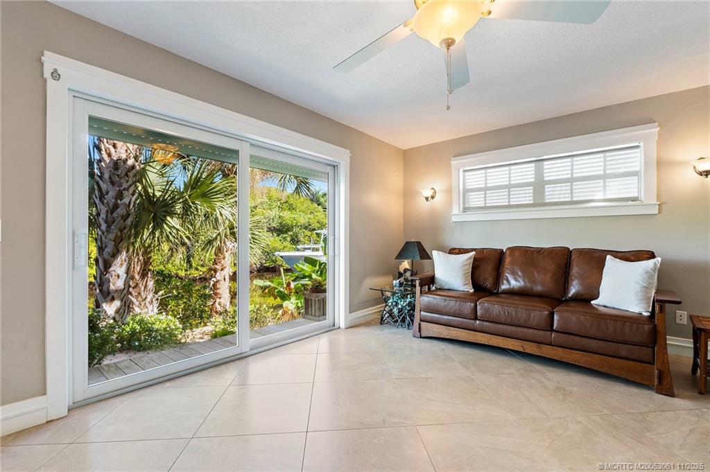 655 Southwest Salerno Road Stuart, FL 34997 - Photo 36 of 84 a living room with furniture and a large window