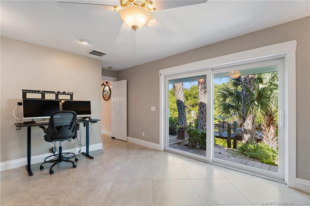 655 Southwest Salerno Road Stuart, FL 34997 - Photo 38 of 84 a view of a workspace with furniture and a window