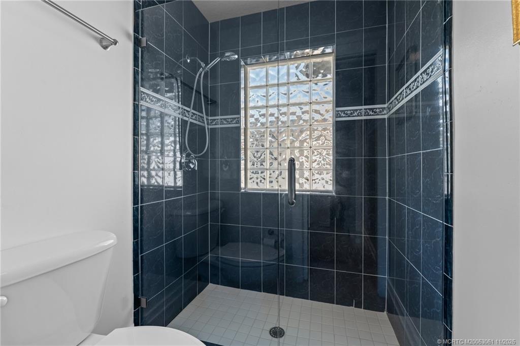 655 Southwest Salerno Road Stuart, FL 34997 - Photo 40 of 84 a bathroom with a shower