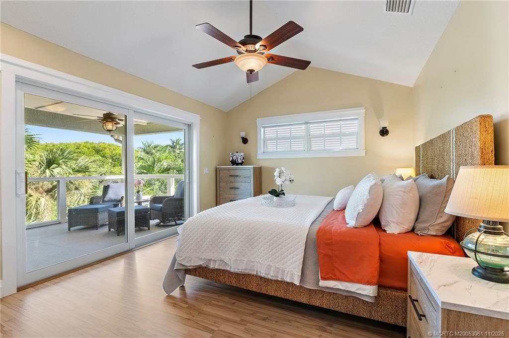 655 Southwest Salerno Road Stuart, FL 34997 - Photo 44 of 84 a bedroom with a bed and a large window with outer view