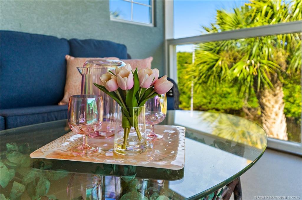 655 Southwest Salerno Road Stuart, FL 34997 - Photo 48 of 84 a view of a dining room with furniture a potted plant and a window