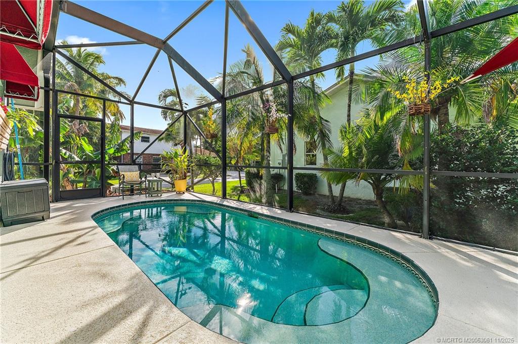 655 Southwest Salerno Road Stuart, FL 34997 - Photo 67 of 84 a view of a swimming pool with a patio