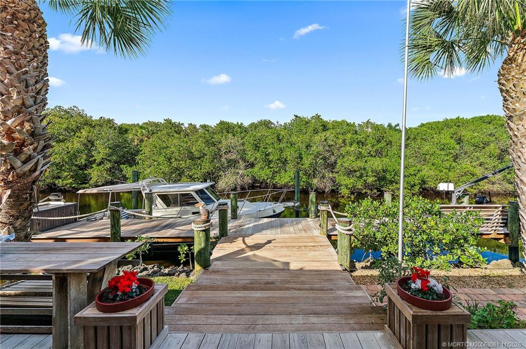 655 Southwest Salerno Road Stuart, FL 34997 - Photo 69 of 84 a view of an chairs and tables in the patio