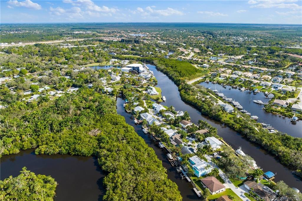 655 Southwest Salerno Road Stuart, FL 34997 - Photo 78 of 84 an aerial view of residential houses with outdoor space