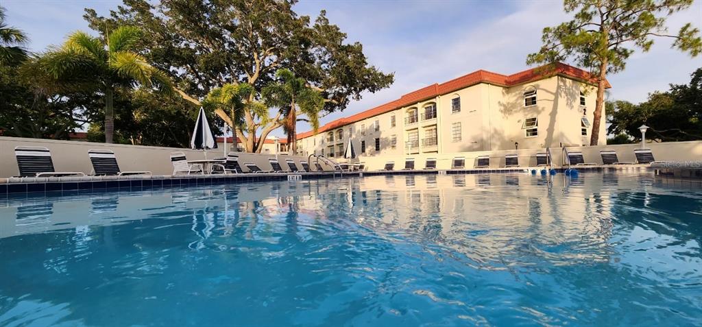 a view of house with river in outdoor space
