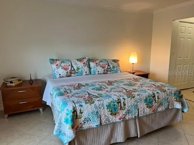 a bedroom with a bed and a couch