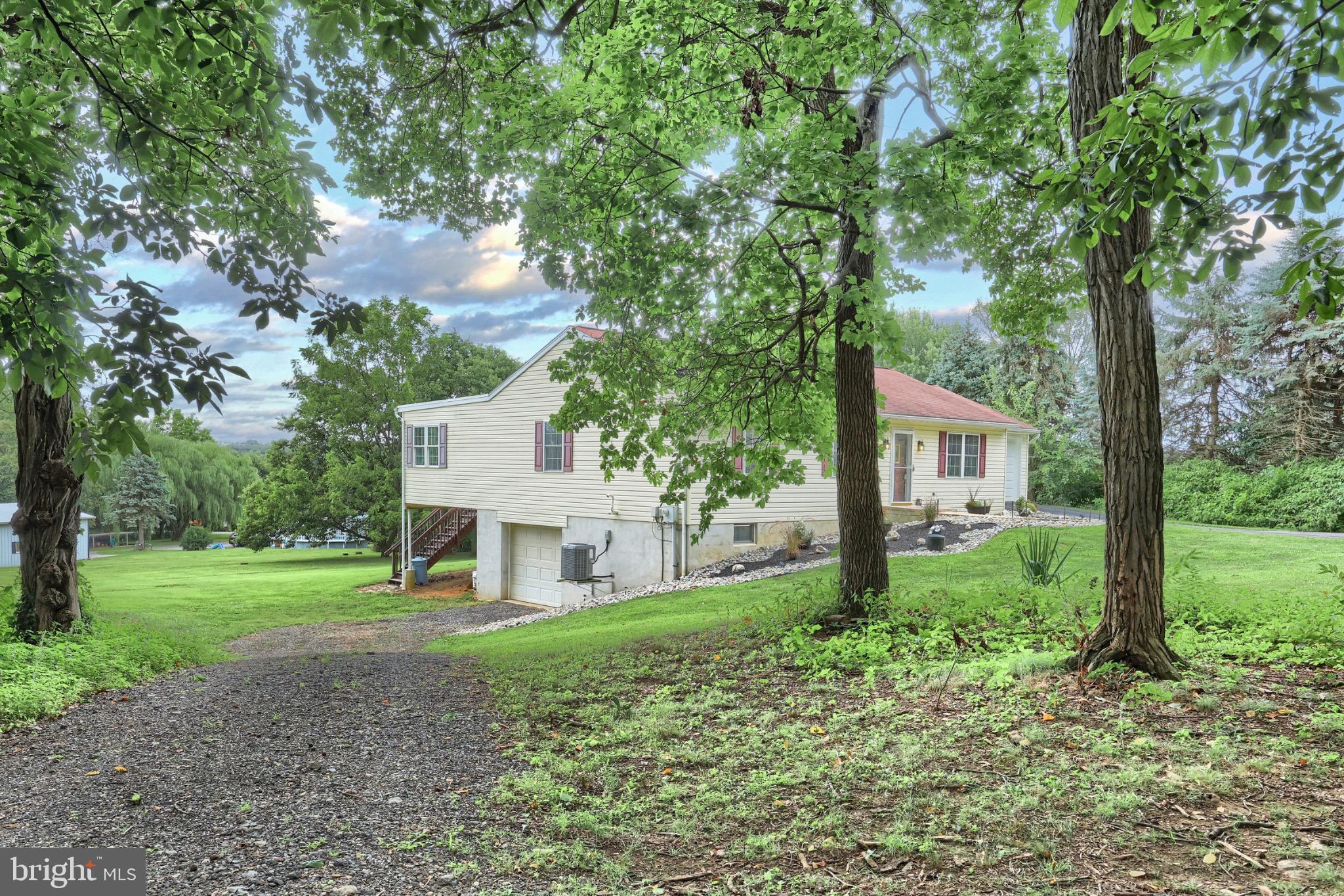 10 Edith Drive Windsor, PA 17366 - Photo 5 of 50 a view of a house with a yard and large trees