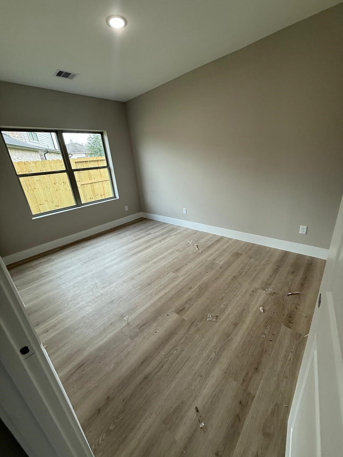 20007 Venetto Street Spring, TX 77388 - Photo 13 of 20 wooden floor in an empty room with a window