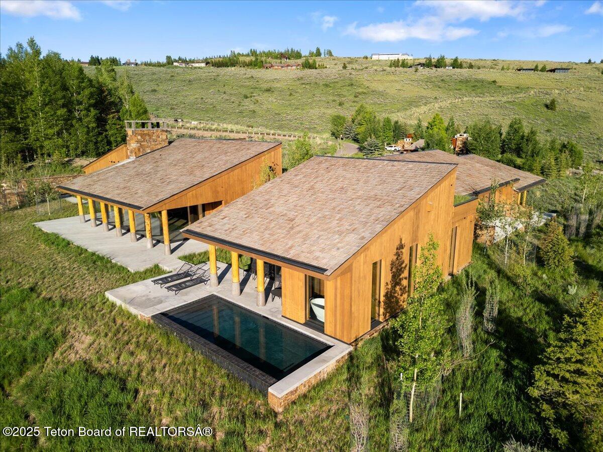 585 Sena Road Jackson, WY 83001 - Photo 10 of 55 SW Elevation. Pool on patio.