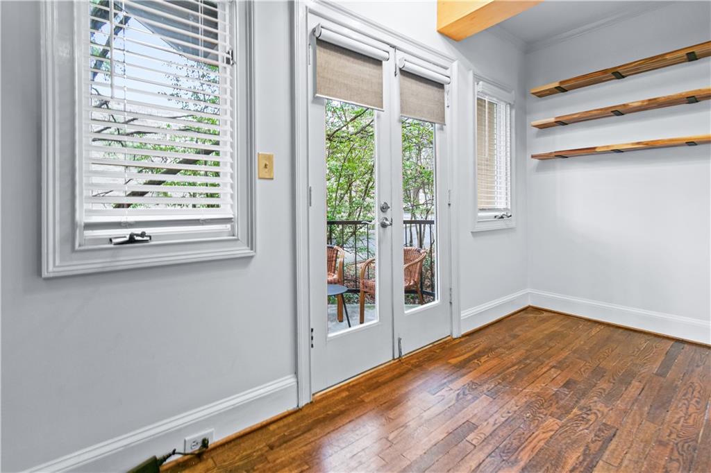 2840 Peachtree Road Northwest, Unit 312 Atlanta, GA 30305 - Photo 11 of 42 a view of empty room with wooden floor and fan