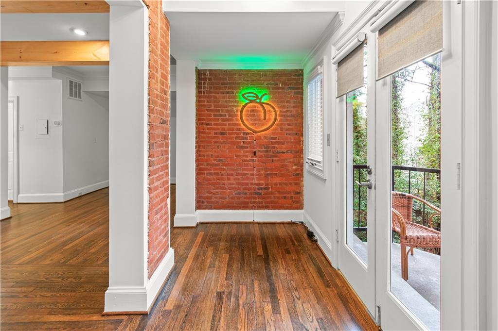 2840 Peachtree Road Northwest, Unit 312 Atlanta, GA 30305 - Photo 13 of 42 a view of entrance door with wooden floor