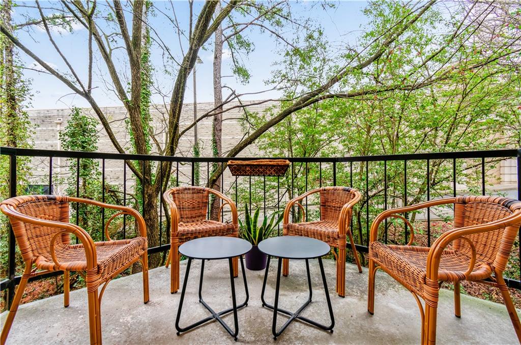 2840 Peachtree Road Northwest, Unit 312 Atlanta, GA 30305 - Photo 16 of 42 a view of a chairs and table in patio