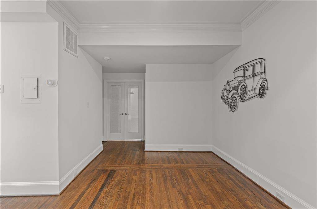 2840 Peachtree Road Northwest, Unit 312 Atlanta, GA 30305 - Photo 22 of 42 a view of a room with wooden floor and a window