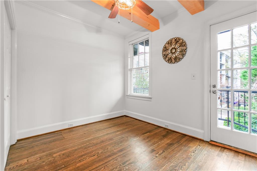 2840 Peachtree Road Northwest, Unit 312 Atlanta, GA 30305 - Photo 24 of 42 wooden floor in an empty room with a window