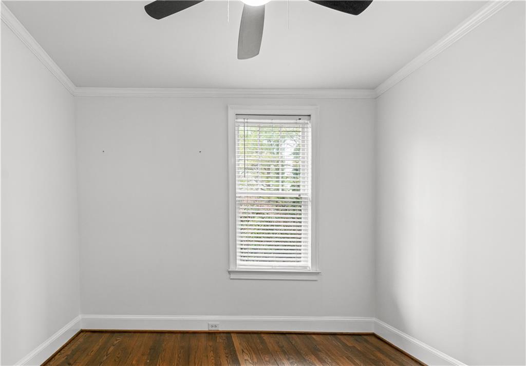 2840 Peachtree Road Northwest, Unit 312 Atlanta, GA 30305 - Photo 30 of 42 a view of a room with a window and wooden floor