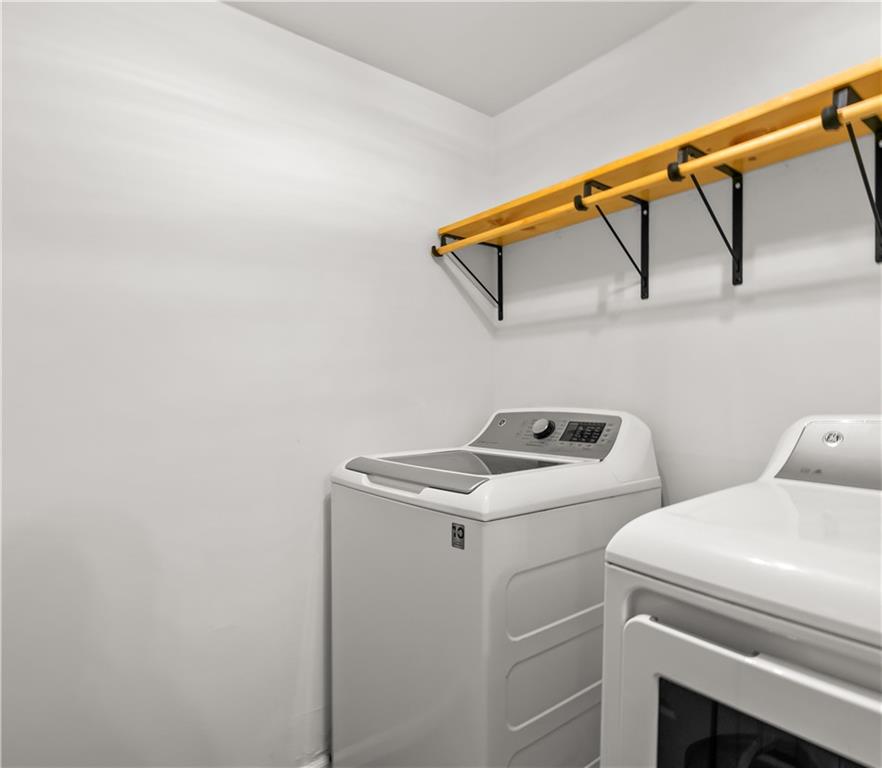 2840 Peachtree Road Northwest, Unit 312 Atlanta, GA 30305 - Photo 37 of 42 a utility room with dryer and washer