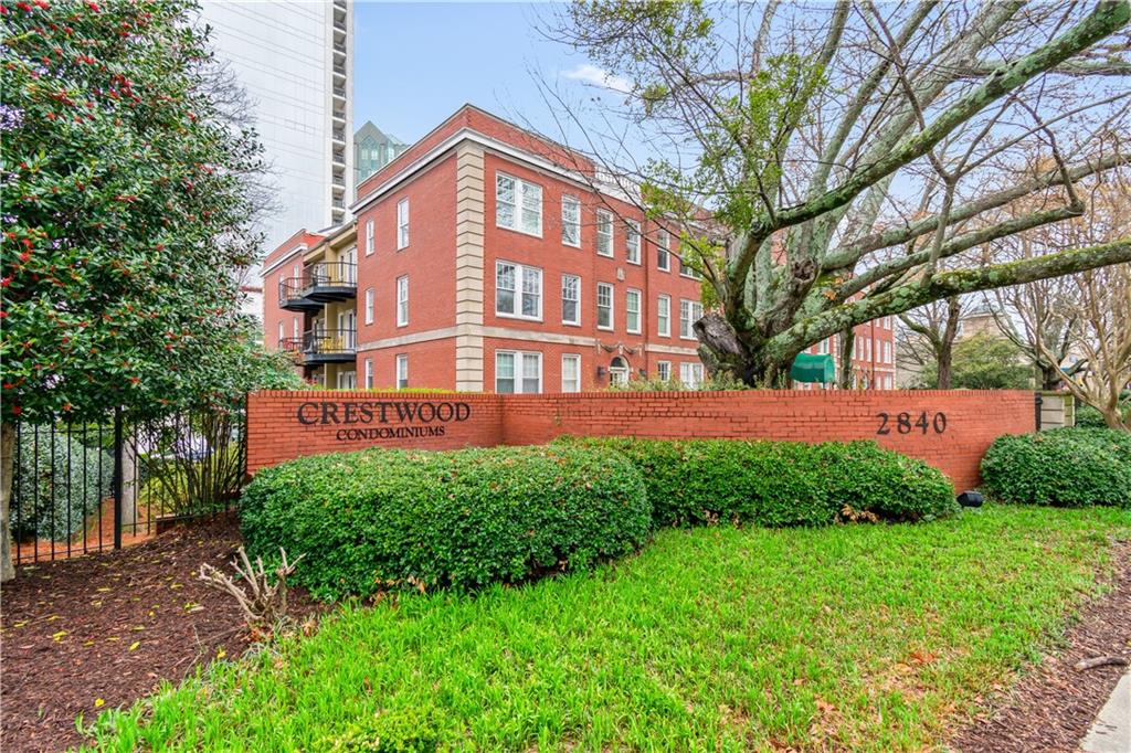 2840 Peachtree Road Northwest, Unit 312 Atlanta, GA 30305 - Photo 38 of 42 a front view of a house with a yard