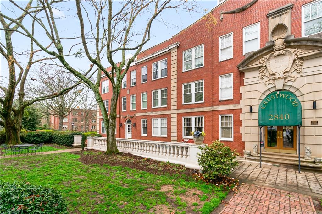 2840 Peachtree Road Northwest, Unit 312 Atlanta, GA 30305 - Photo 39 of 42 a front view of a building with garden