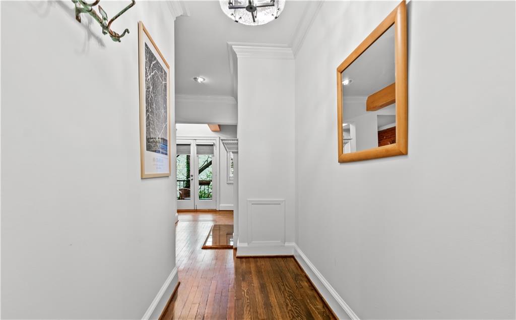 2840 Peachtree Road Northwest, Unit 312 Atlanta, GA 30305 - Photo 4 of 42 a view of a hallway with wooden floor and staircase
