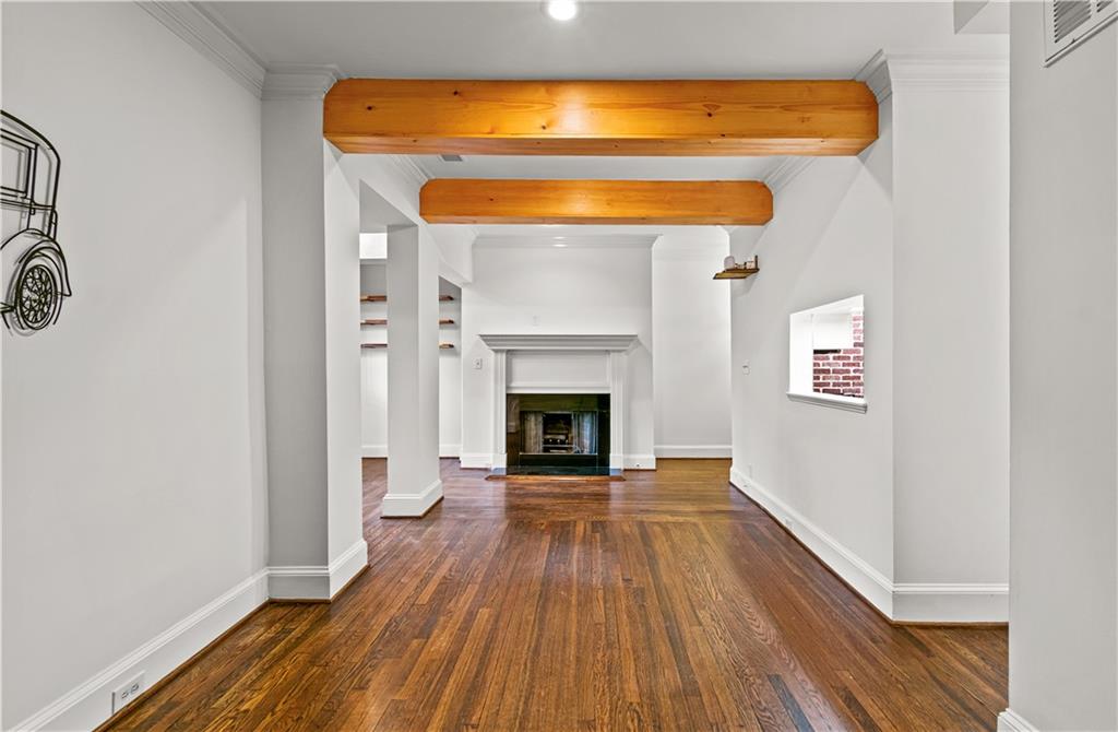 2840 Peachtree Road Northwest, Unit 312 Atlanta, GA 30305 - Photo 7 of 42 a view of a livingroom with wooden floor and a fireplace