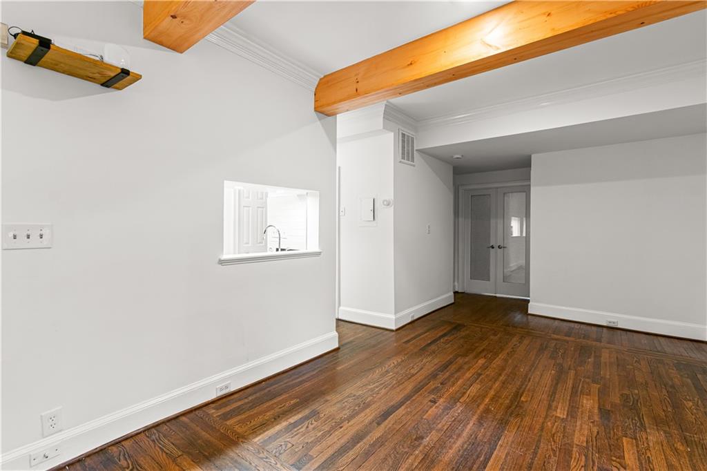 2840 Peachtree Road Northwest, Unit 312 Atlanta, GA 30305 - Photo 9 of 42 a view of an empty room with wooden floor