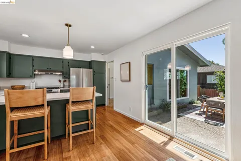 a open kitchen with a table and chairs