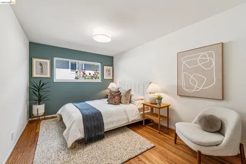 a bedroom with a bed and dresser