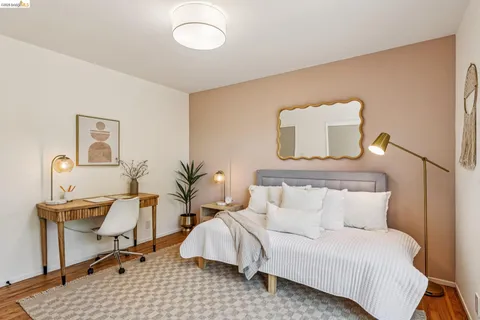 a bedroom with a bed and a table