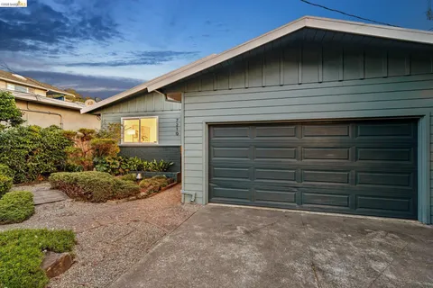 a house with trees in front of it