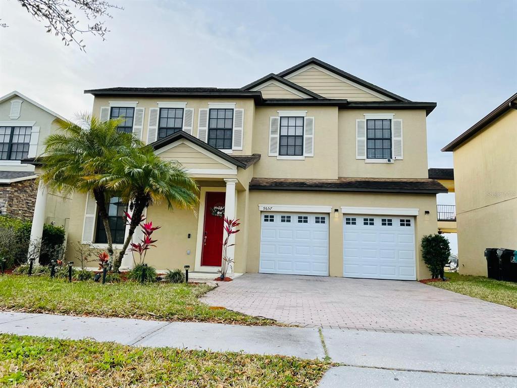 a front view of a house with a yard