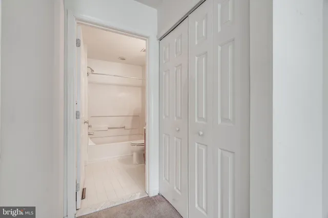 a bathroom with a glass shower door