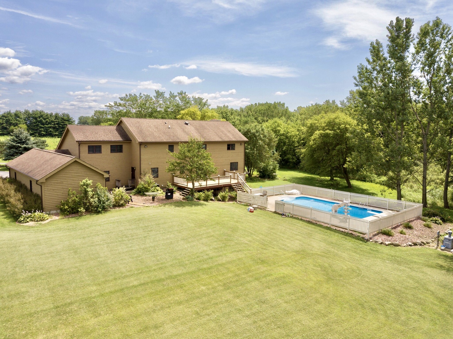 8101 Greenwood Road Hebron, IL 60034 - Photo 2 of 39 a view of a house with swimming pool and sitting area