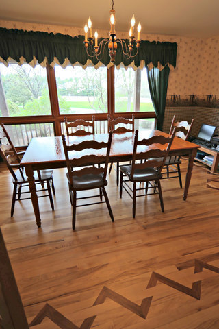 8101 Greenwood Road Hebron, IL 60034 - Photo 11 of 39 a view of a patio with dining table and chairs with wooden floor