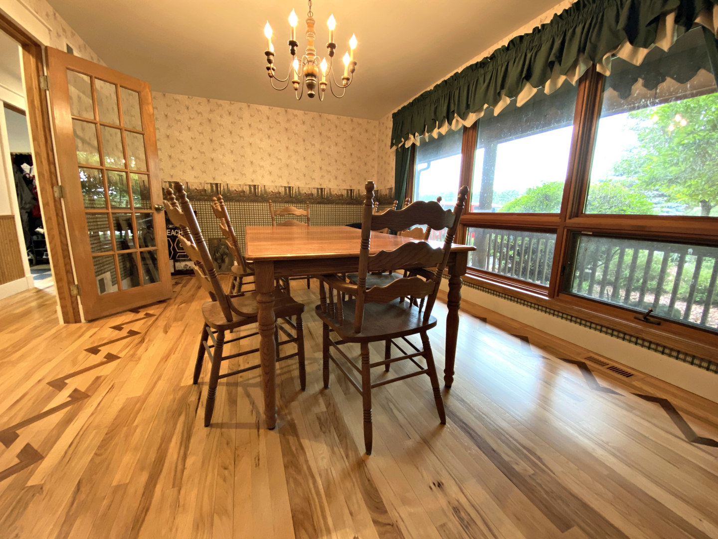 8101 Greenwood Road Hebron, IL 60034 - Photo 12 of 39 a view of a dining room with furniture window and wooden floor