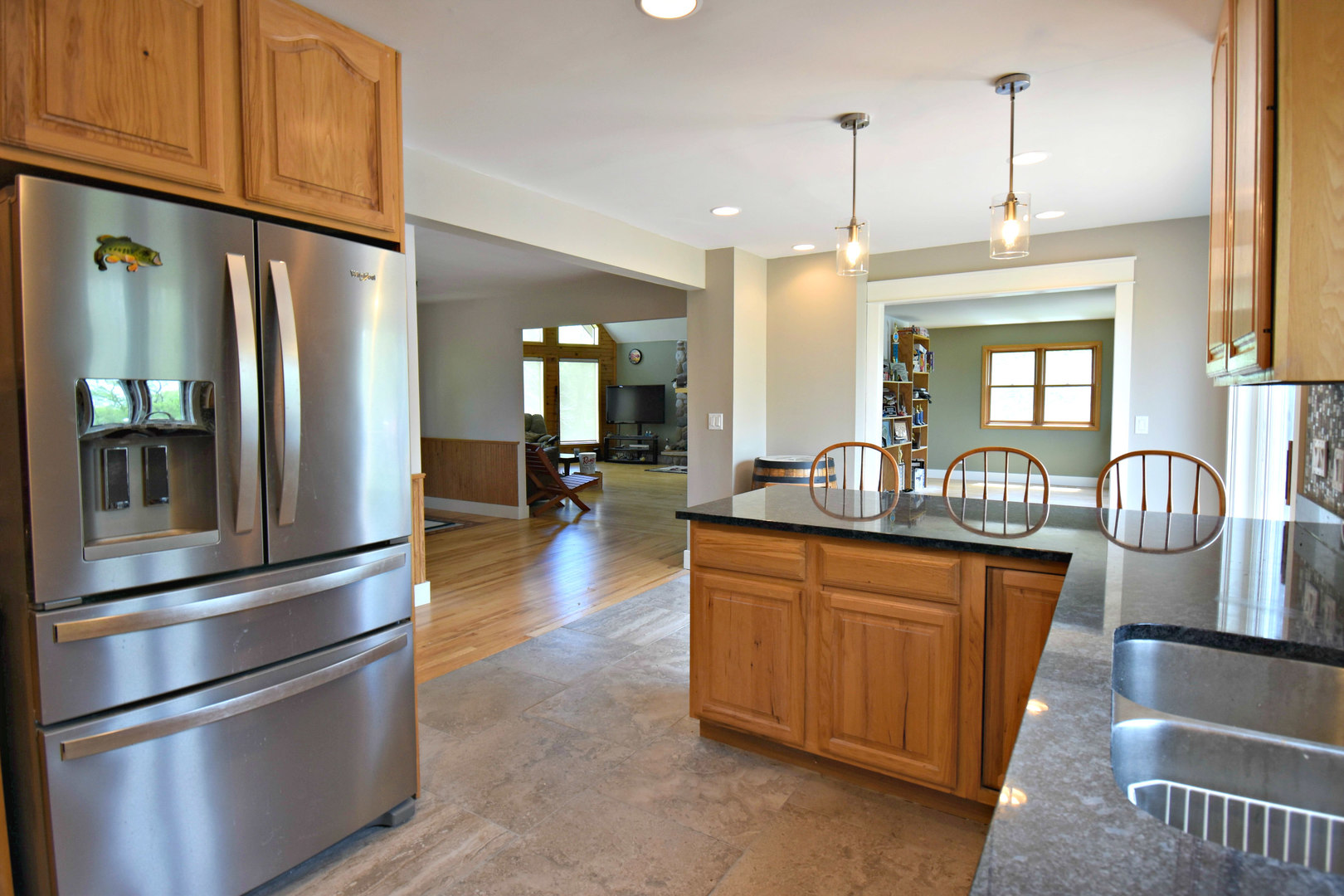 8101 Greenwood Road Hebron, IL 60034 - Photo 17 of 39 a kitchen with stainless steel appliances granite countertop a refrigerator and a stove